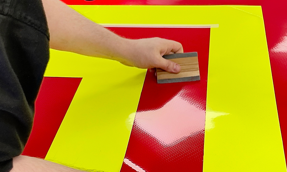 A Chevron Kit Being Applied with a squeegee